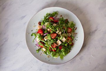 Strawberry and feta cheese salad. Healthy diet summer food. Overhead horizontal image
