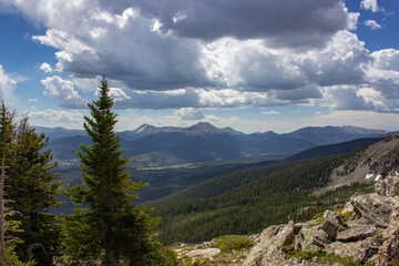 mountain landscape with clouds, Clouds rolling in over the Mountains and Valley, Sun Peaking through the clouds in the mountains