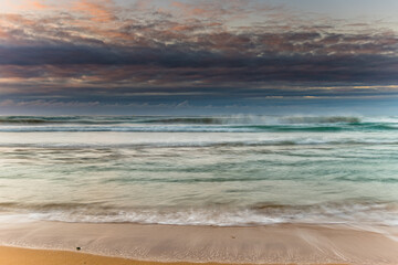 Sunrise seascape and low cloud bank