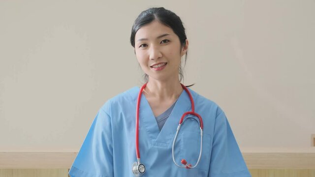 portrait of smart asian female doctor explain and suggesting a way to takecare yourself with happiness smiling cheerful Caring for patients at the hospital