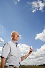 Senior man holding a mobile phone