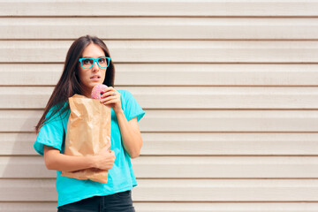 Funny Girl Eating Donuts Strait Out of a Paper Bag