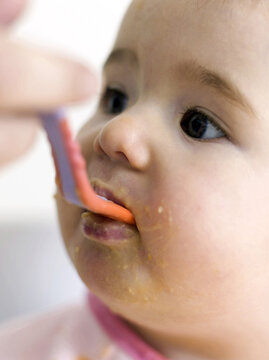 Baby Being Fed With Baby Food