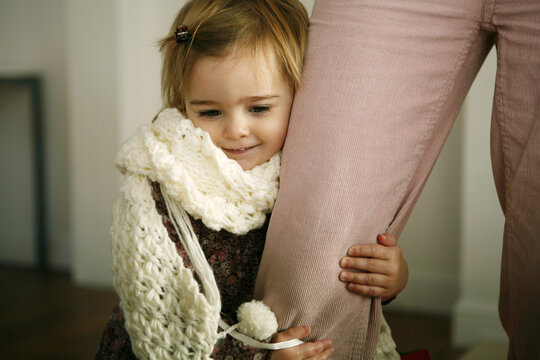 Girl Hugging Her Mother's Leg