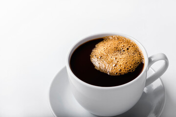 Coffee cup with bubbles isolated on white background.