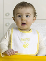 Baby girl wearing bib