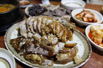 Focus on the Korean style braised pork belly with the side dishes at Korean restaurant, Seoul, South Korea