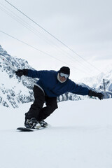 A man snowboarding
