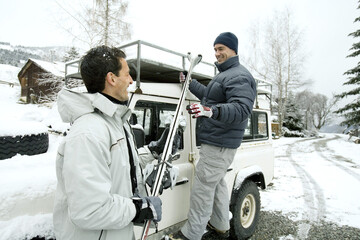 Men holding ski poles