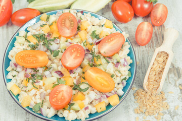 Fresh salad with bulgur groats and vegetables. Healthy lifestyles and nutrition