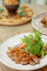 organic grilled pork neck on wooden rustic table