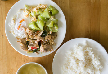 rice with stir fried chili chicken fried egg and Zucchini pan fried with egg
