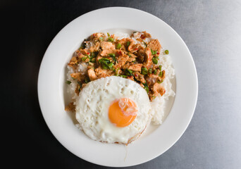 fried curry chicken with rice and fried egg