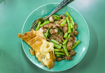 fried curry entrail eat with rice and omelet