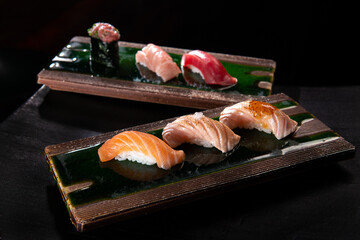 Premuim japanese sushi set on black background © lmanju
