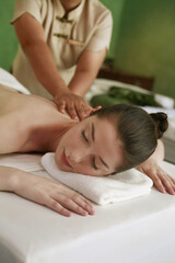 Fototapeta na wymiar Woman enjoying a back massage