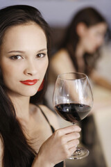Woman with a glass of red wine