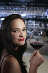 Woman with a glass of red wine