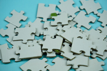 random jigsaw puzzle incomplete concept on blue background