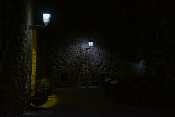 Night scene of medieval castle on the beach in girona, 2018