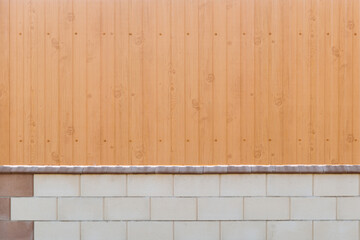 Tin fence with a beautiful textured pattern. Modern fence with vertical stripes.