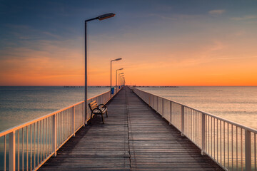 Fototapeta na wymiar Walking pontoon on the sea shore in the morning