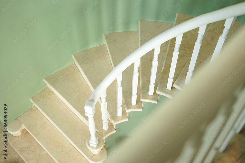 Wall mural spiral staircase in a building