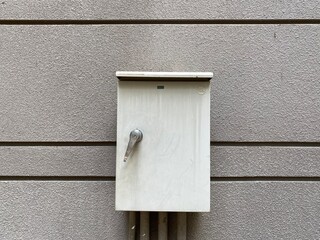 Texture of old gray concrete wall with control box