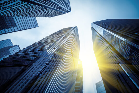 Fototapeta Modern tall buildings seen from below. Diminishing perspective