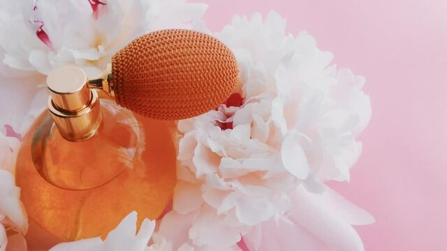 Citrus perfume bottle with peony flowers, chic fragrance scent as luxury cosmetic, fashion and beauty product backgrounds