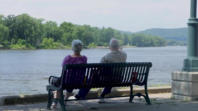 Older couple overlooking the Mississippi River on a sunny hot afternoon.