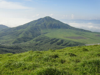 Fototapeta premium Mt.Eboshi and huge grass field area of Mt. Aso(active volcano) range in Kumamoto Japan