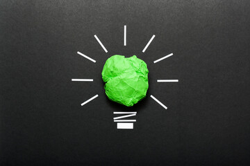 Obraz premium Inspiration concept crumpled color paper light bulb metaphor for good idea