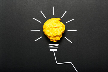 Inspiration concept crumpled color paper light bulb metaphor for good idea