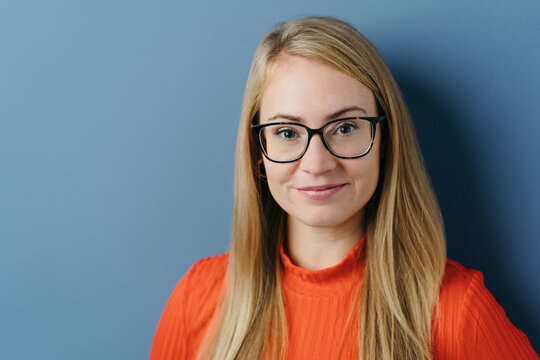 Pretty young blond woman wearing trendy glasses