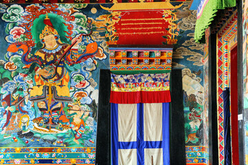 Tibetan monks read mantra and pray in the prayer hall at Rumtek Monastery, gangtok, sikkim
