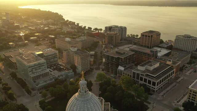 Aerial view of City of Madison. The capital city of Wisconsin from above. Drone flying over Wisconsin State Capitol in downtown. Sunny morning, sunrise (sunset), sunlight, summertime