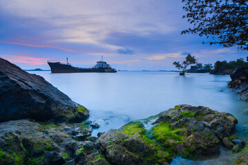 Tangker and barge in sunset on beach Batam island