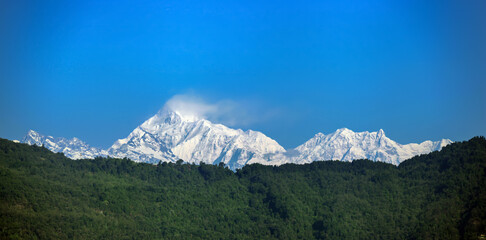Fototapeta na wymiar Snowy white peaks of Nathula Pass at Sikkim, India