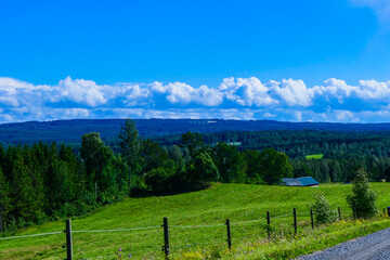 Fototapeta na wymiar Tidaholm, Sweden A country landscape oer farmland.