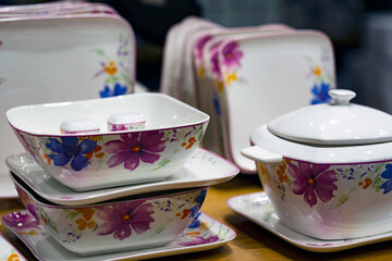 Luxury white ceramic plates on a table is the background selective focus and shallow depth of field
