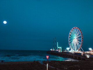 ´pier ferris wheel at night atlantic city new jersey, sunset time