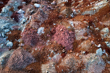 textures of various clay layers underground in  clay quarry after  geological study of  soil. colored layers of clay and stone in  section of  earth, different rock formations and soil layers.