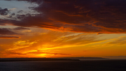 The sunsets over the sea near Thornwick Bay, Flamborough Head, East Yorkshire, UK
