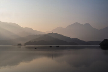 morning light shining in  peaceful mountain in the lake