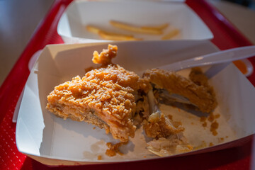 Fried chicken leftover in paper box