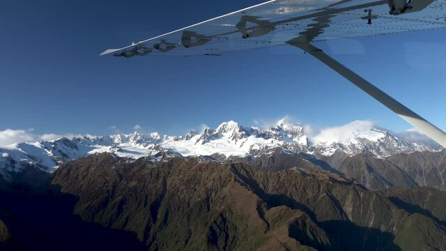 Scenic flight looking out to an aerial view of Aoraki Mount Cook and Mount Tasman in New Zealand