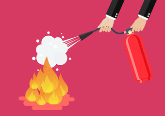 Businessman with fire extinguisher is fighting with the burning flame