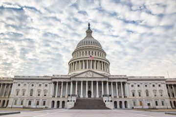 Naklejka premium The Capitol Hill, congress building in Washington DC, on a cloudy day.