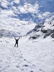 Naklejka na ściany i meble Manali, India - June 14th 2019: Sense of Achievement when we reach the goal/peak of Humpta Pass trek in Indian Himalayan Mountains.